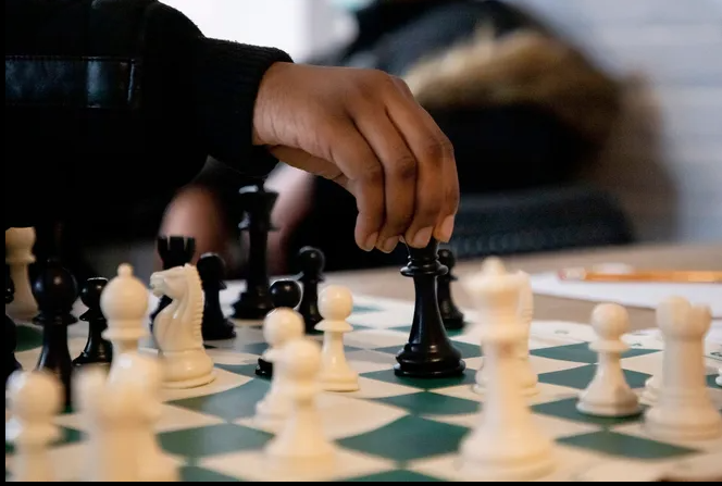  Student playing chess
